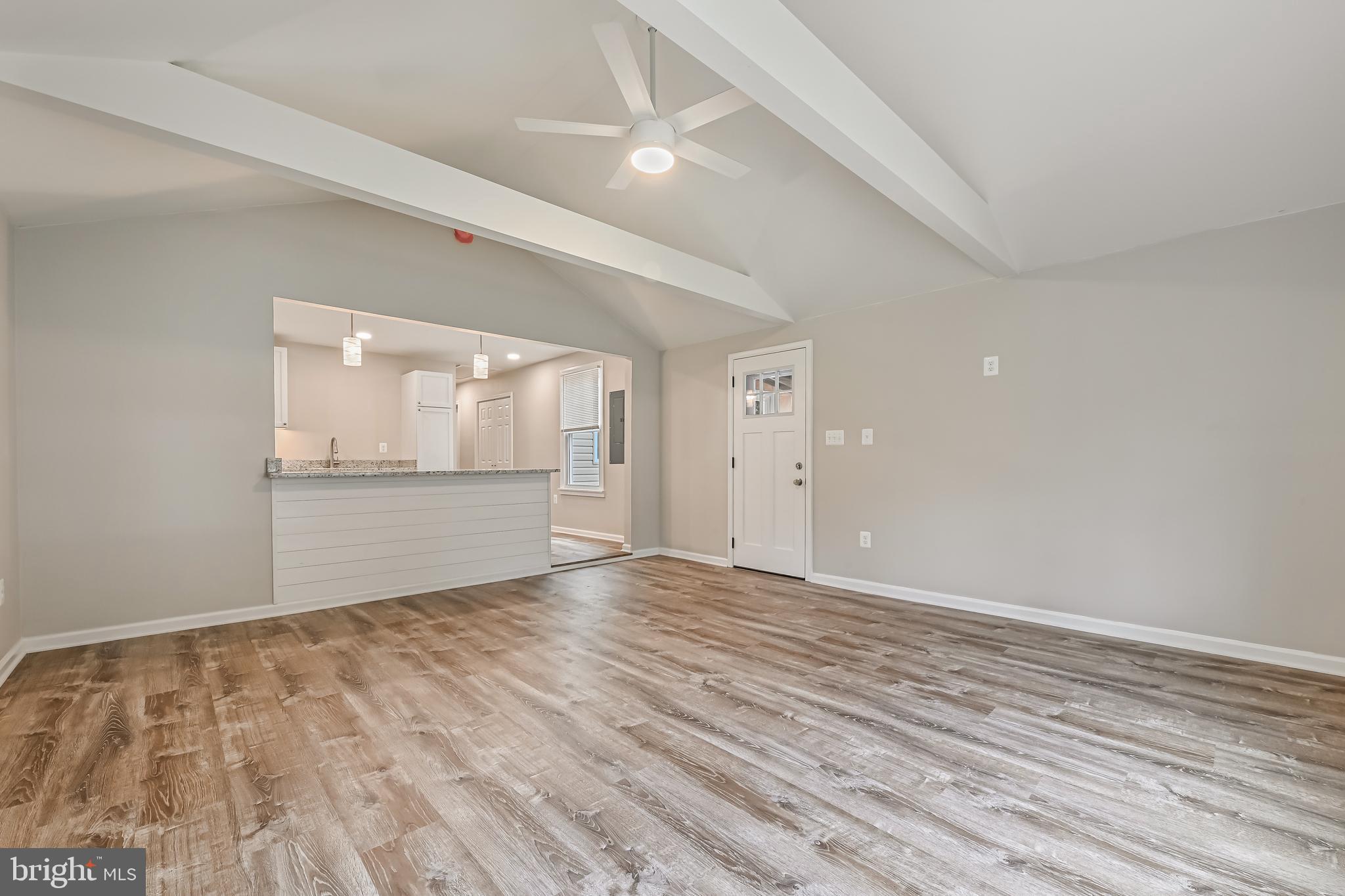 405 Bayview Drive Edgewater, MD 21037 - Photo 3 of 28 wooden floor in an empty room with a window