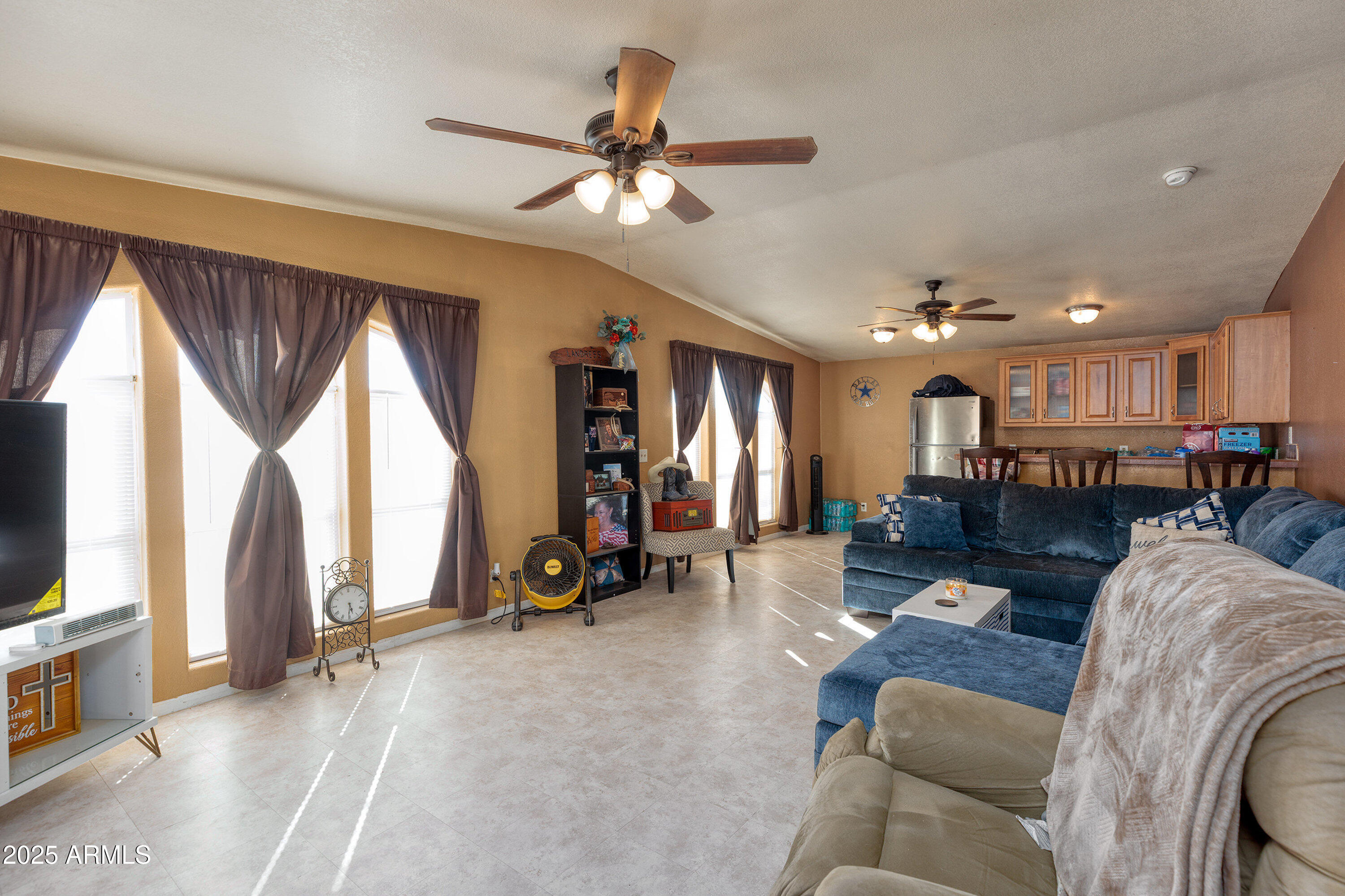 1008 West Rim View Road Payson, AZ 85541 - Photo 12 of 25 a living room with furniture gym equipment and a flat screen tv