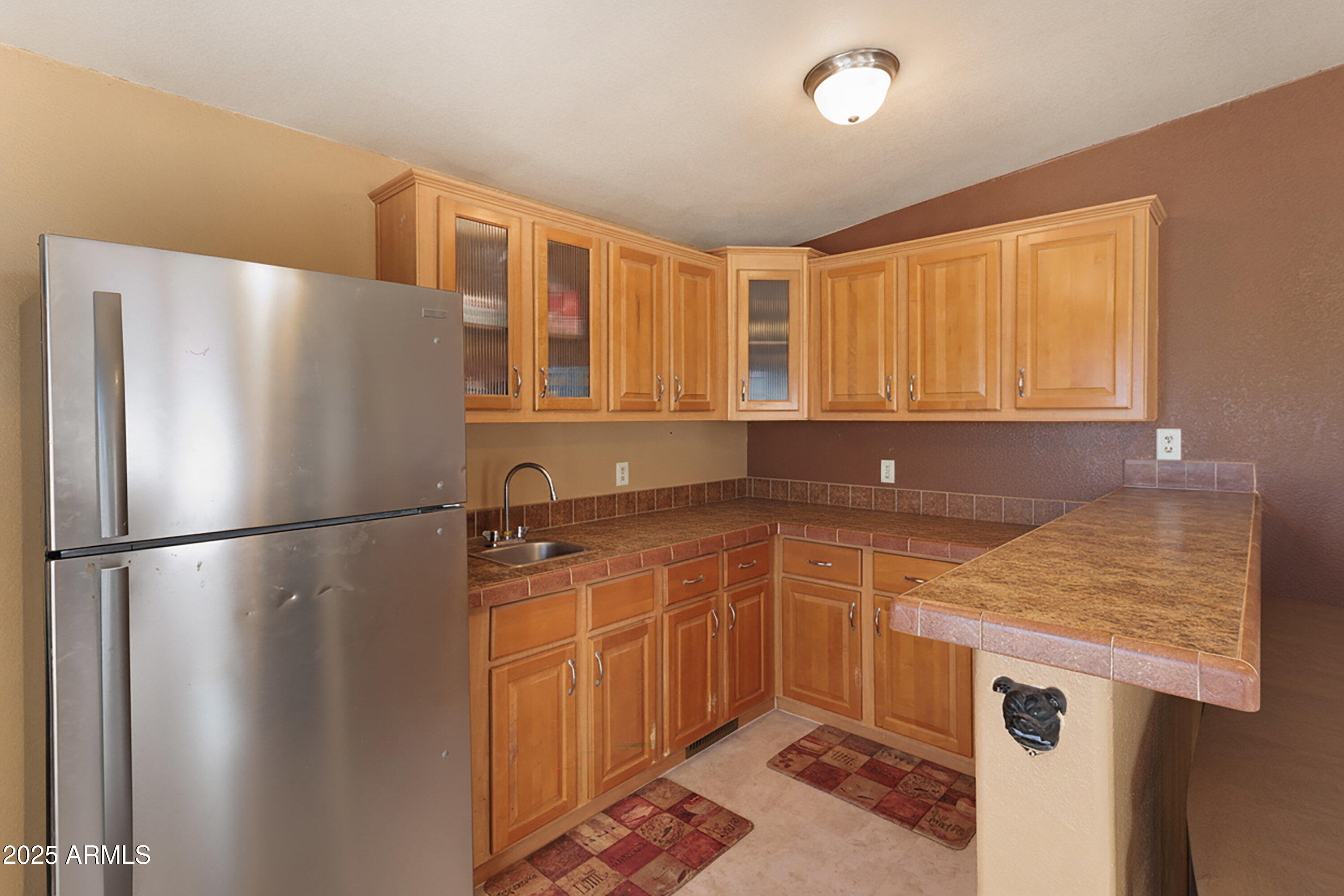 1008 West Rim View Road Payson, AZ 85541 - Photo 13 of 25 a kitchen with stainless steel appliances granite countertop a refrigerator a sink and a stove