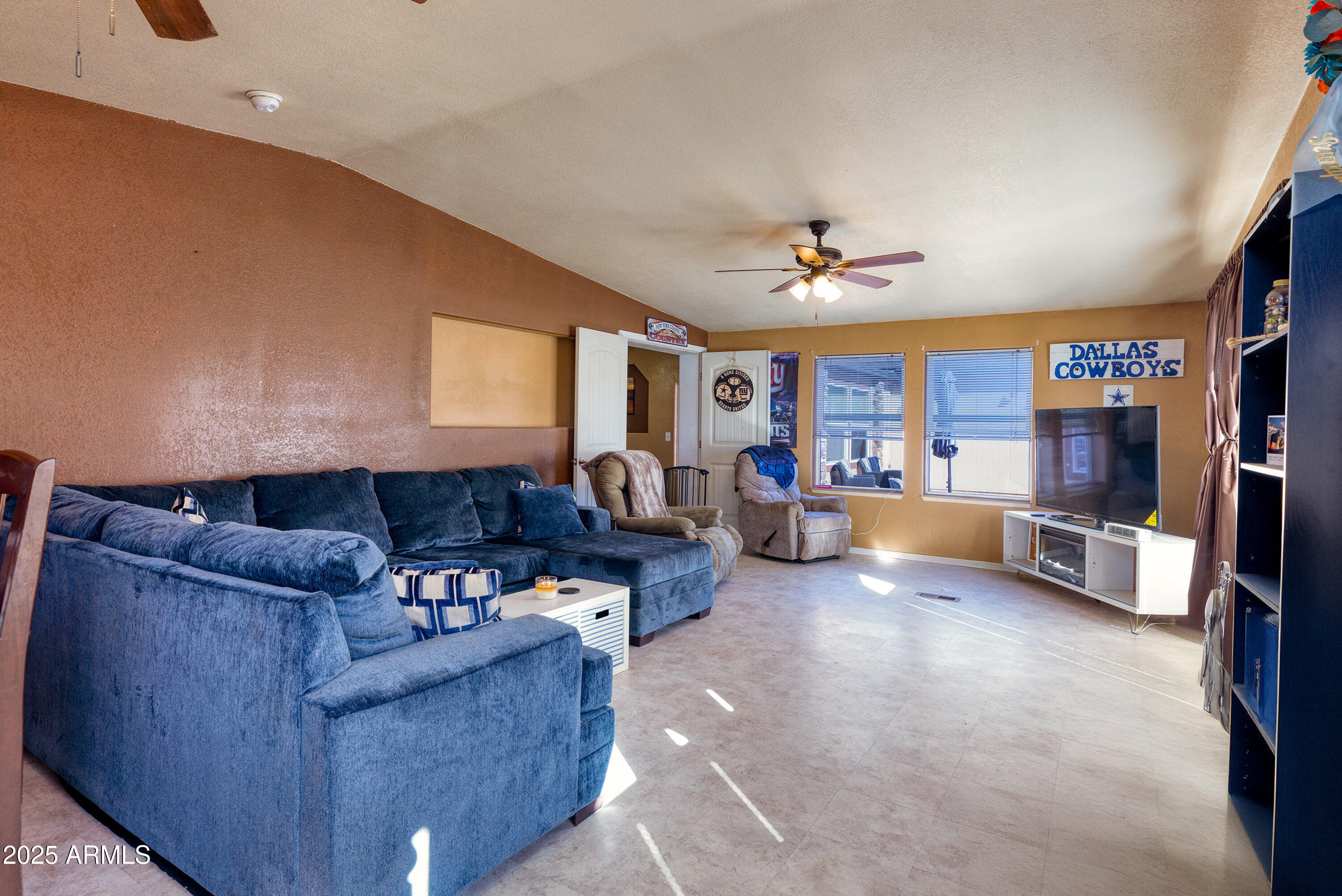 1008 West Rim View Road Payson, AZ 85541 - Photo 14 of 25 a living room with furniture and a flat screen tv