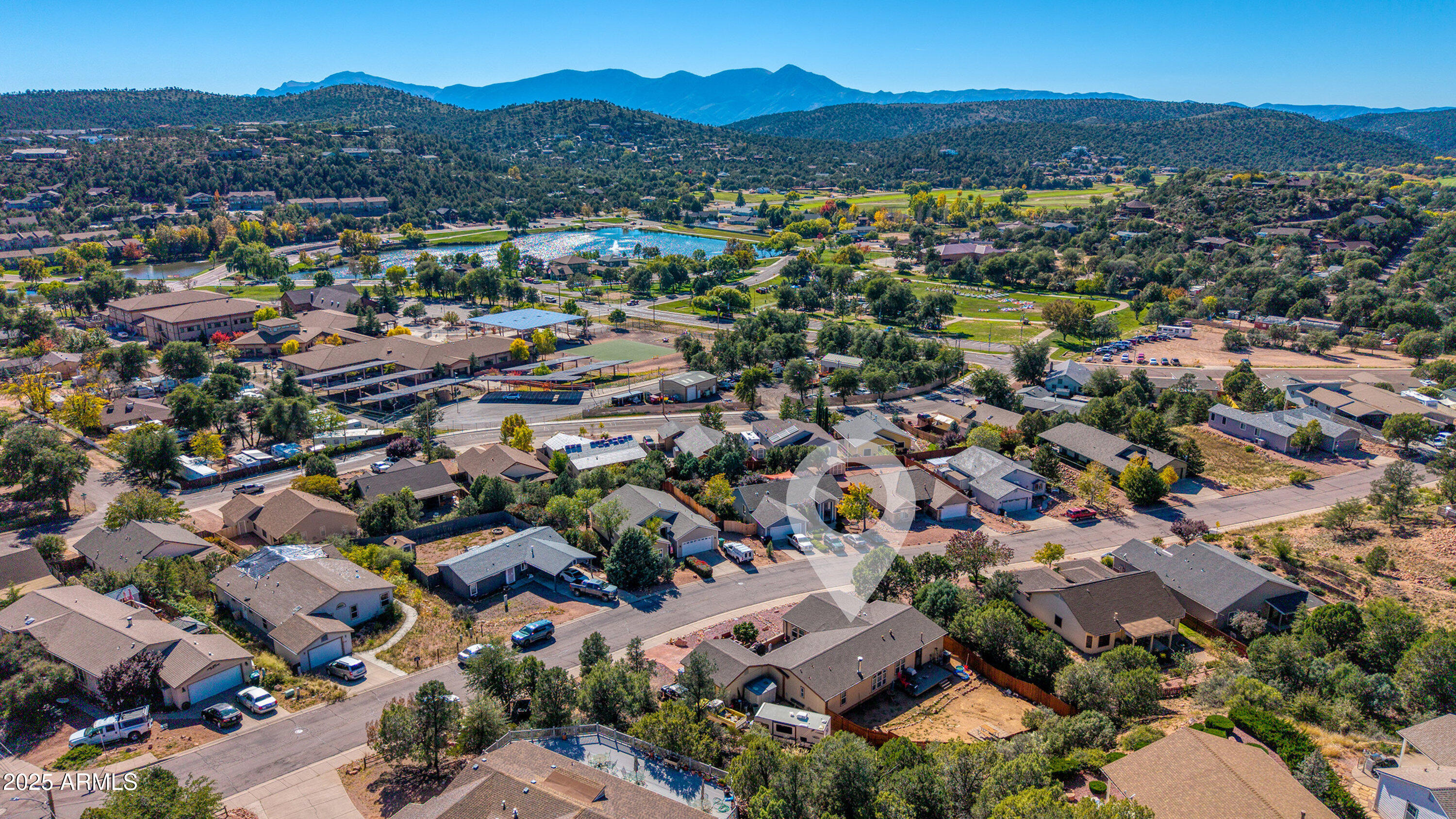 1008 West Rim View Road Payson, AZ 85541 - Photo 4 of 25 an aerial view of a city with lots of residential buildings and mountain view in back
