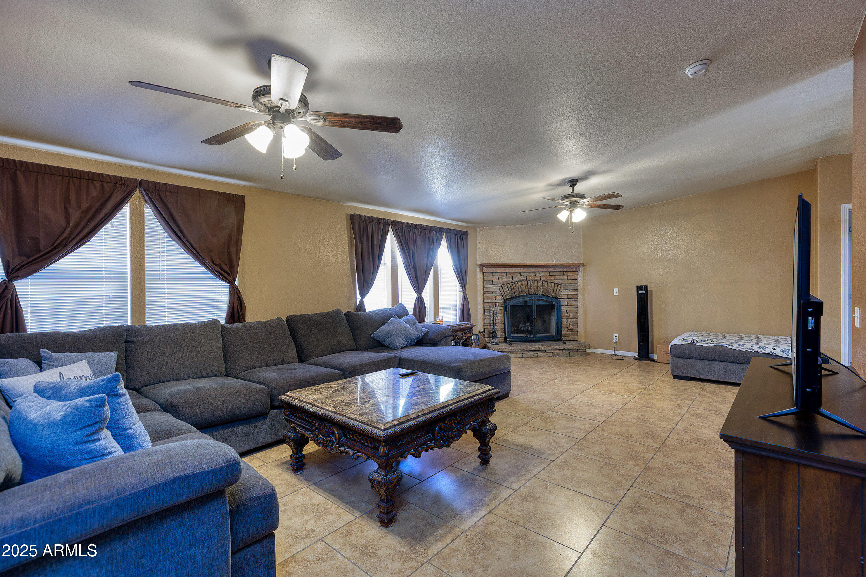 1008 West Rim View Road Payson, AZ 85541 - Photo 6 of 25 a living room with furniture and a fireplace