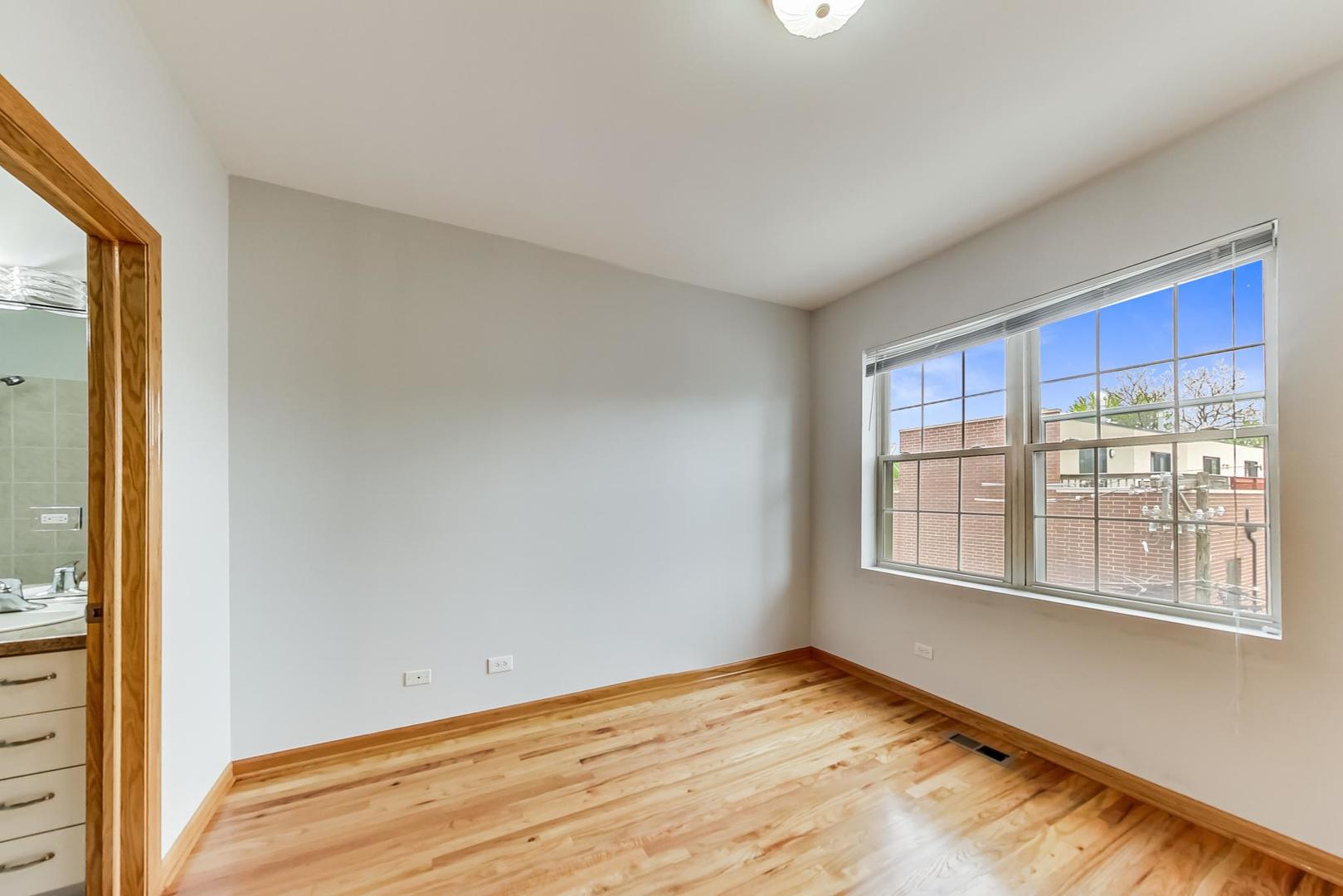 2032 West Division Street, Unit 201N Chicago, IL 60622 - Photo 12 of 18 a view of an empty room with a window