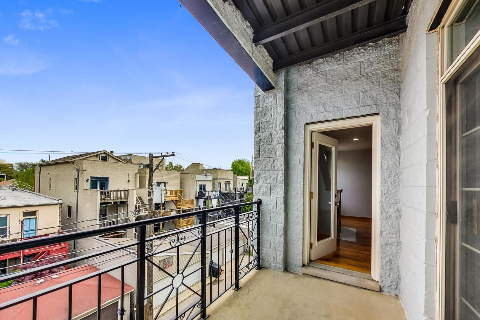 2032 West Division Street, Unit 201N Chicago, IL 60622 - Photo 17 of 18 a view of a balcony with a potted plant