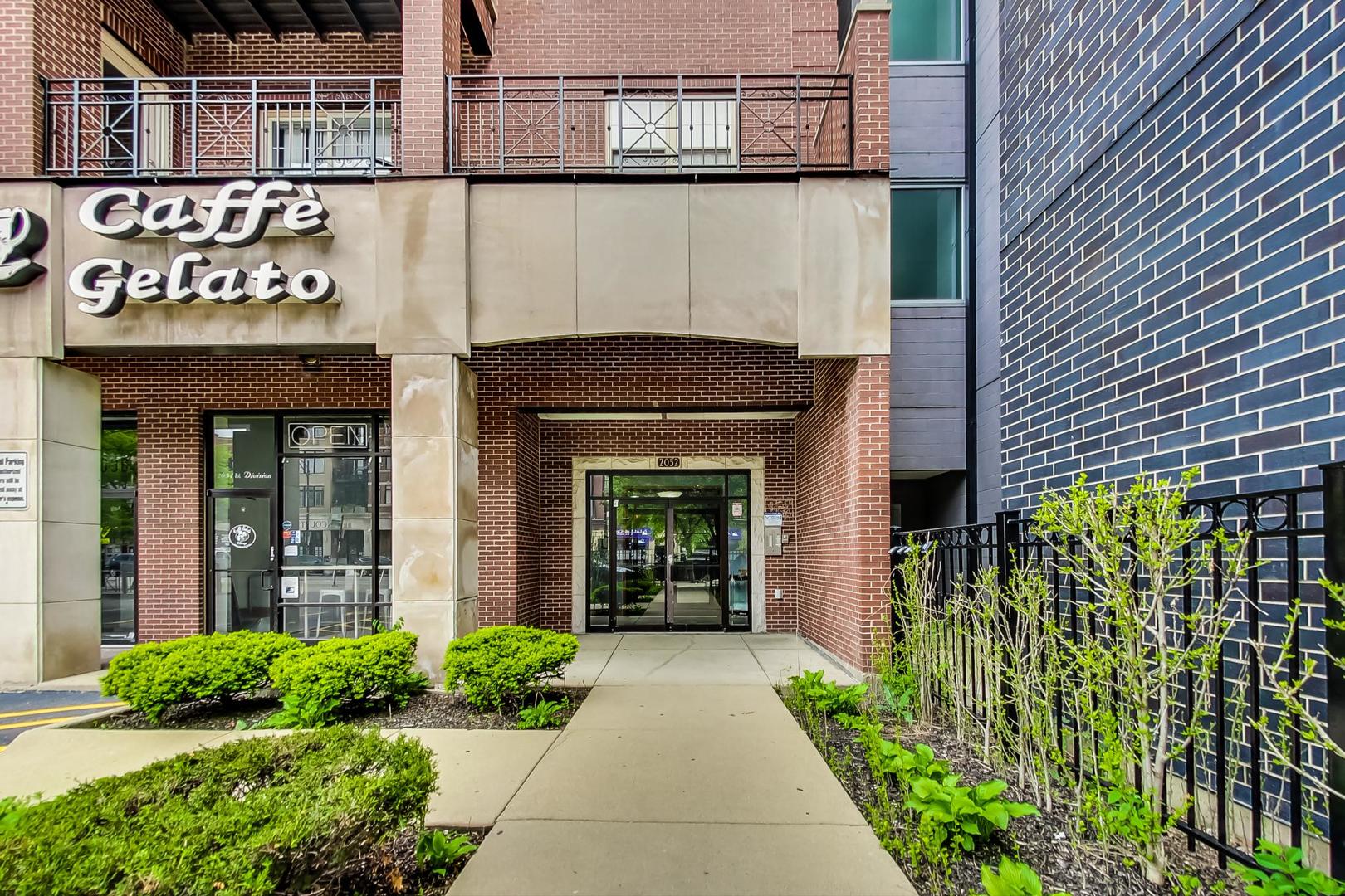 2032 West Division Street, Unit 201N Chicago, IL 60622 - Photo 4 of 18 a front view of a building with garden