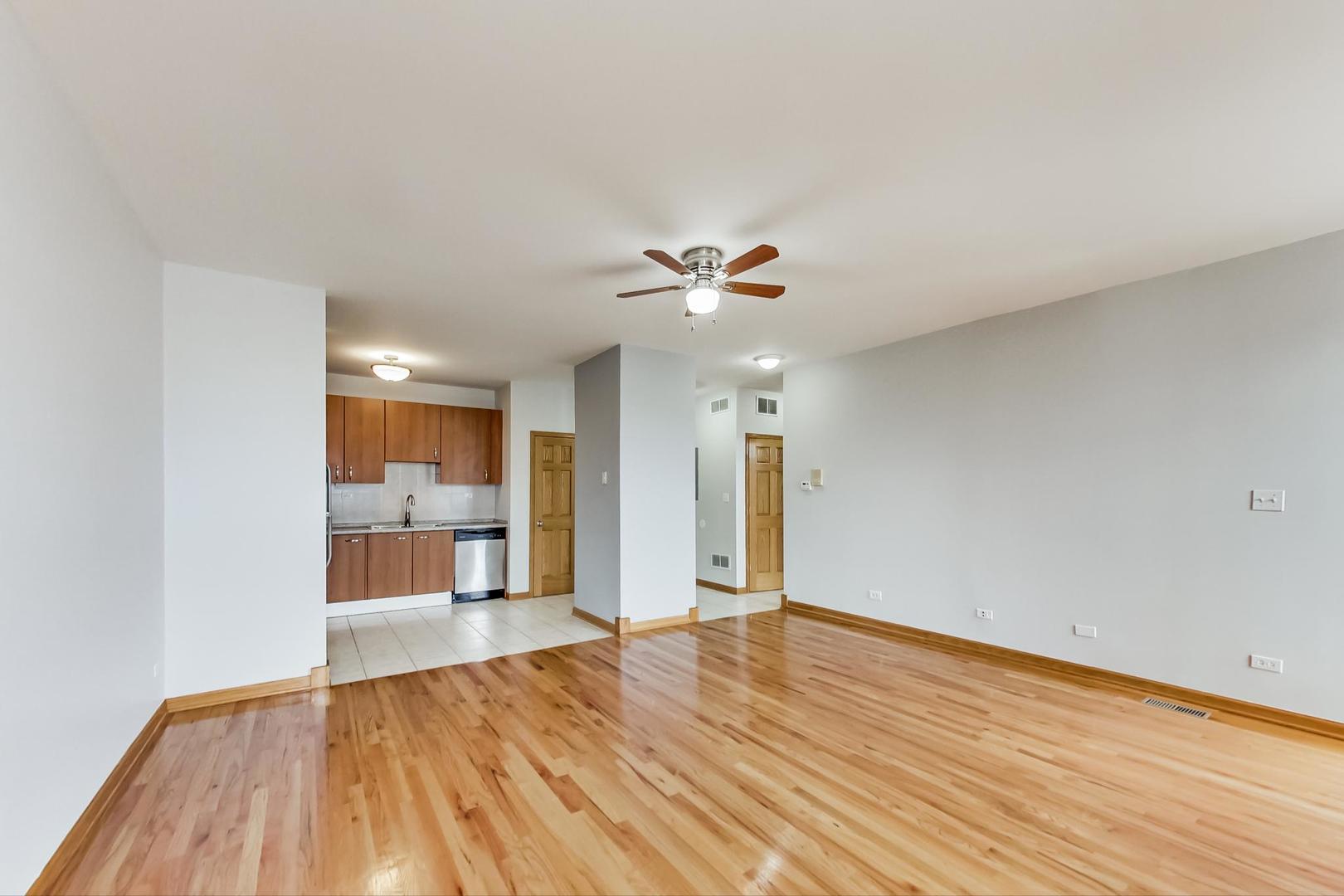 2032 West Division Street, Unit 201N Chicago, IL 60622 - Photo 8 of 18 a view of an empty room and wooden floor