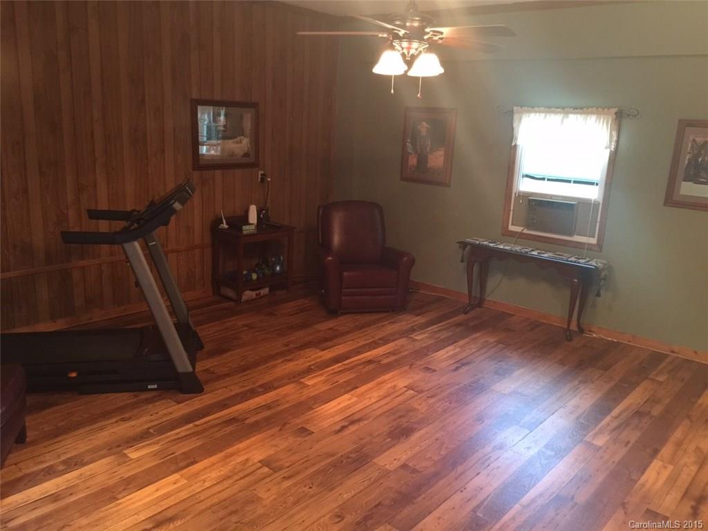 8018 Unity Church Road Kannapolis, NC 28081 - Photo 14 of 24 a living room with furniture and a wooden floor