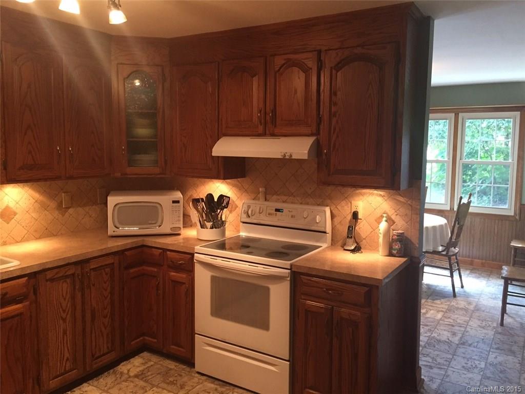 8018 Unity Church Road Kannapolis, NC 28081 - Photo 8 of 24 a kitchen with a stove and a cabinets