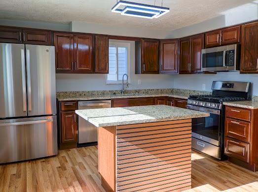 526 Magazine Street Carnegie, PA 15106 - Photo 7 of 20 a kitchen with stainless steel appliances a microwave a stove a sink and a refrigerator