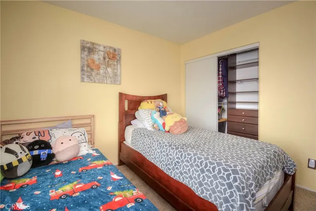 a bathroom with a toilet a sink a mirror a vanity and window