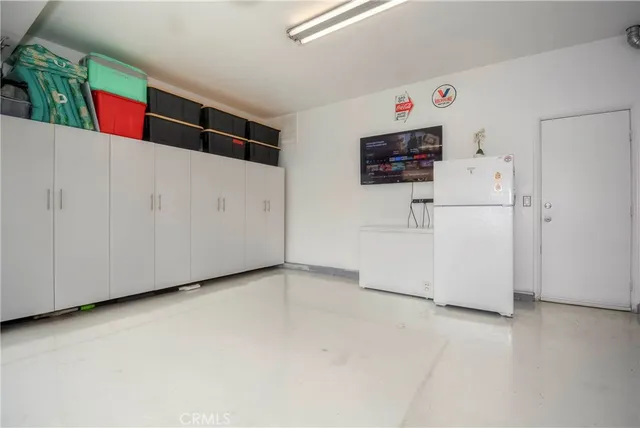 an outdoor space with patio and white umbrellas