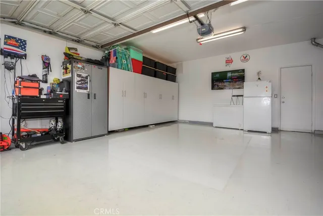 a view of a backyard with table and chairs
