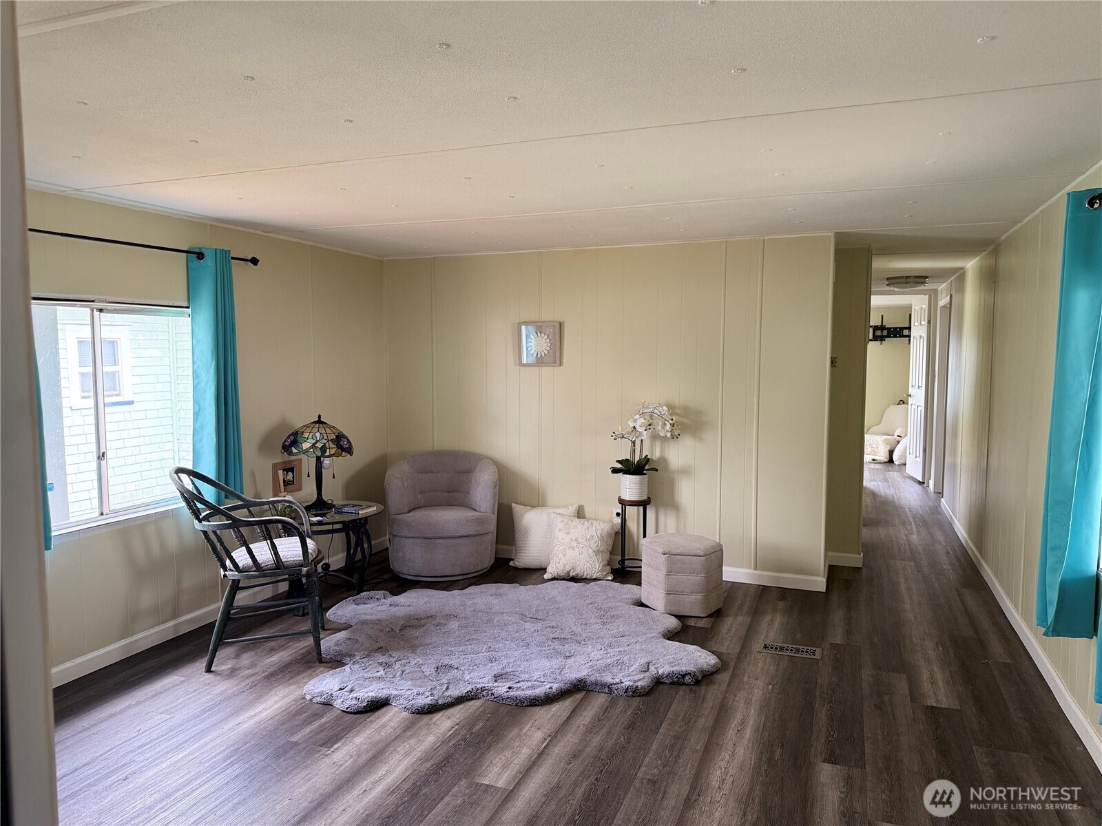 1308 263rd Place Ocean Park, WA 98640 - Photo 12 of 35 a bedroom with furniture and a wooden floor