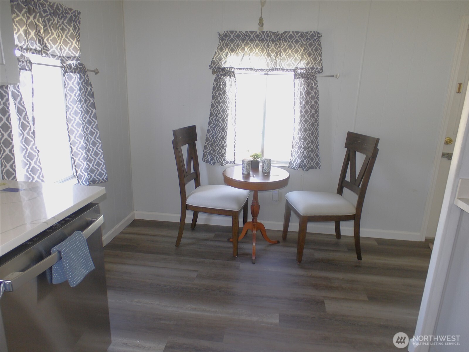 1308 263rd Place Ocean Park, WA 98640 - Photo 13 of 35 a view of a dining room with furniture window and wooden floor