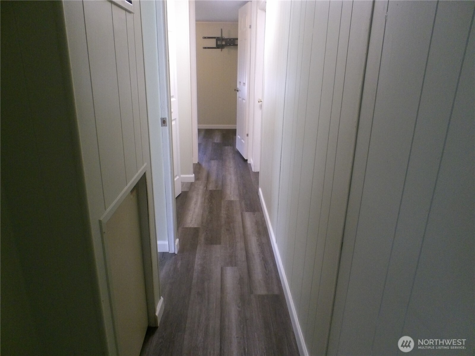 1308 263rd Place Ocean Park, WA 98640 - Photo 18 of 35 a view of a hallway with wooden floor