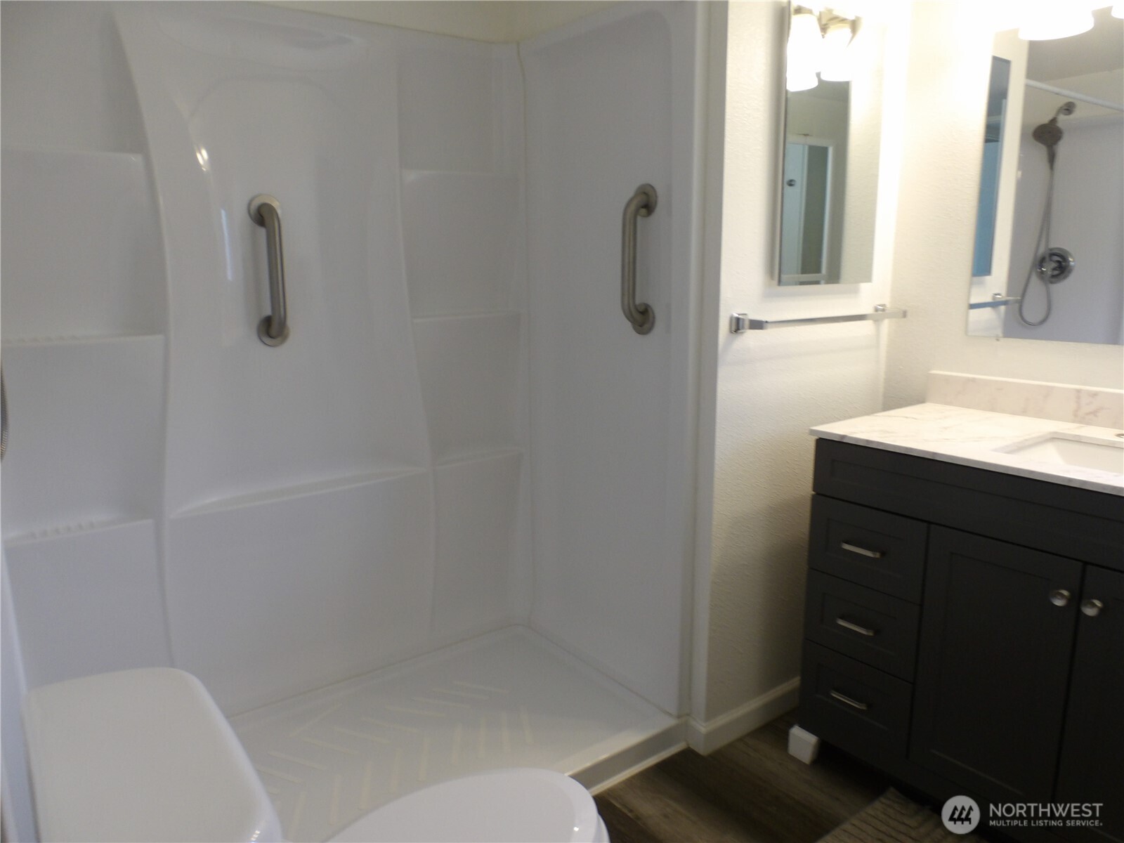 1308 263rd Place Ocean Park, WA 98640 - Photo 22 of 35 a bathroom with a shower a toilet and a sink