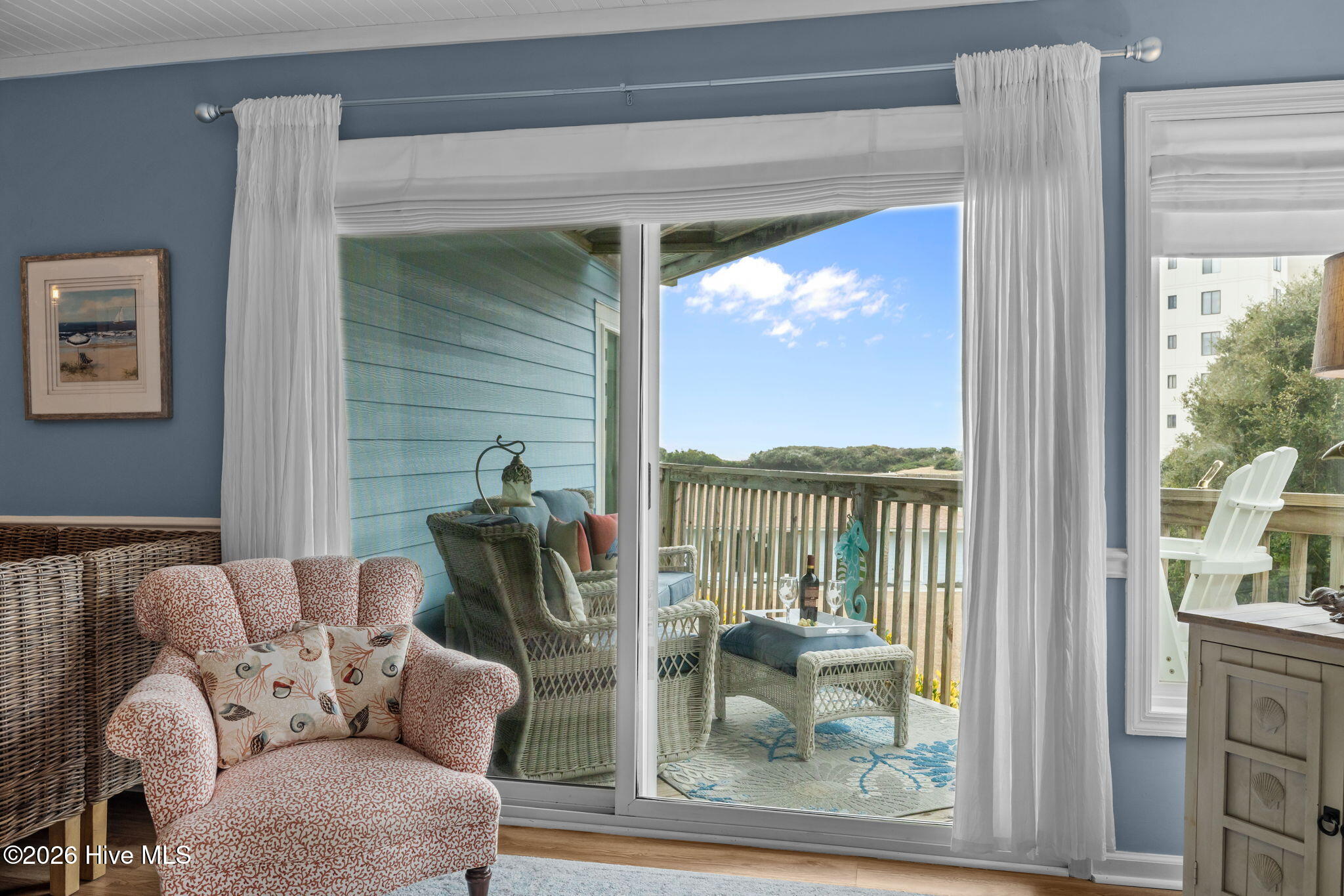 8801 Reed Drive, Unit N 106 Emerald Isle, NC 28594 - Photo 20 of 50 Living area with back porch with ocean views