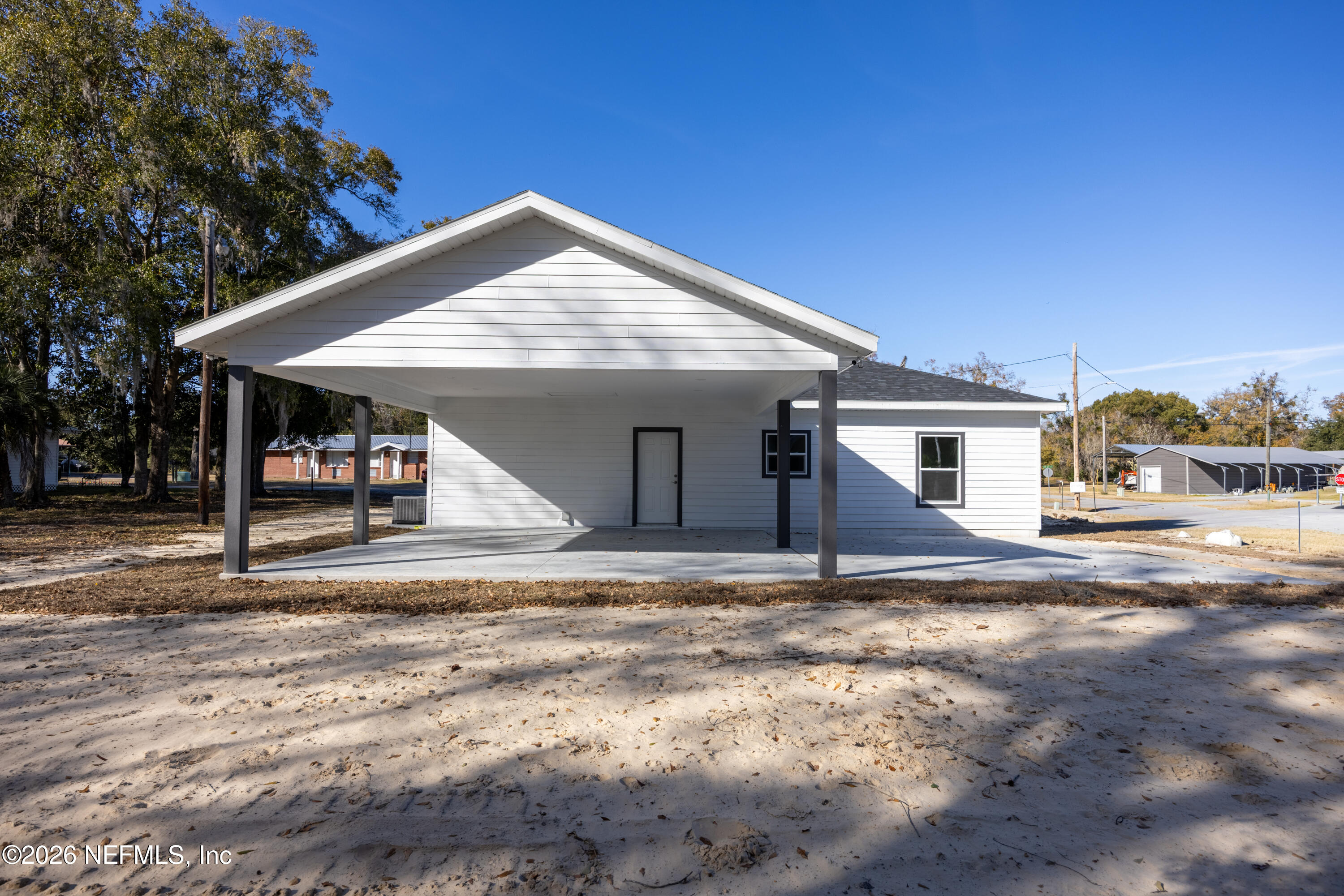 220 Southwest 3rd Street Lake Butler, FL 32054 - Photo 12 of 48 a view of a house with a entertaining space