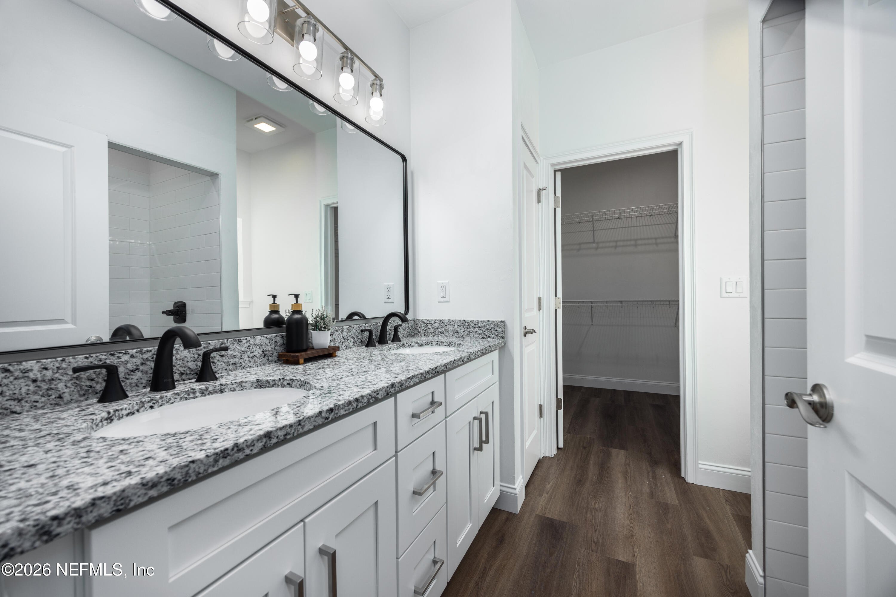 220 Southwest 3rd Street Lake Butler, FL 32054 - Photo 14 of 40 a bathroom with a granite countertop sink double and mirror