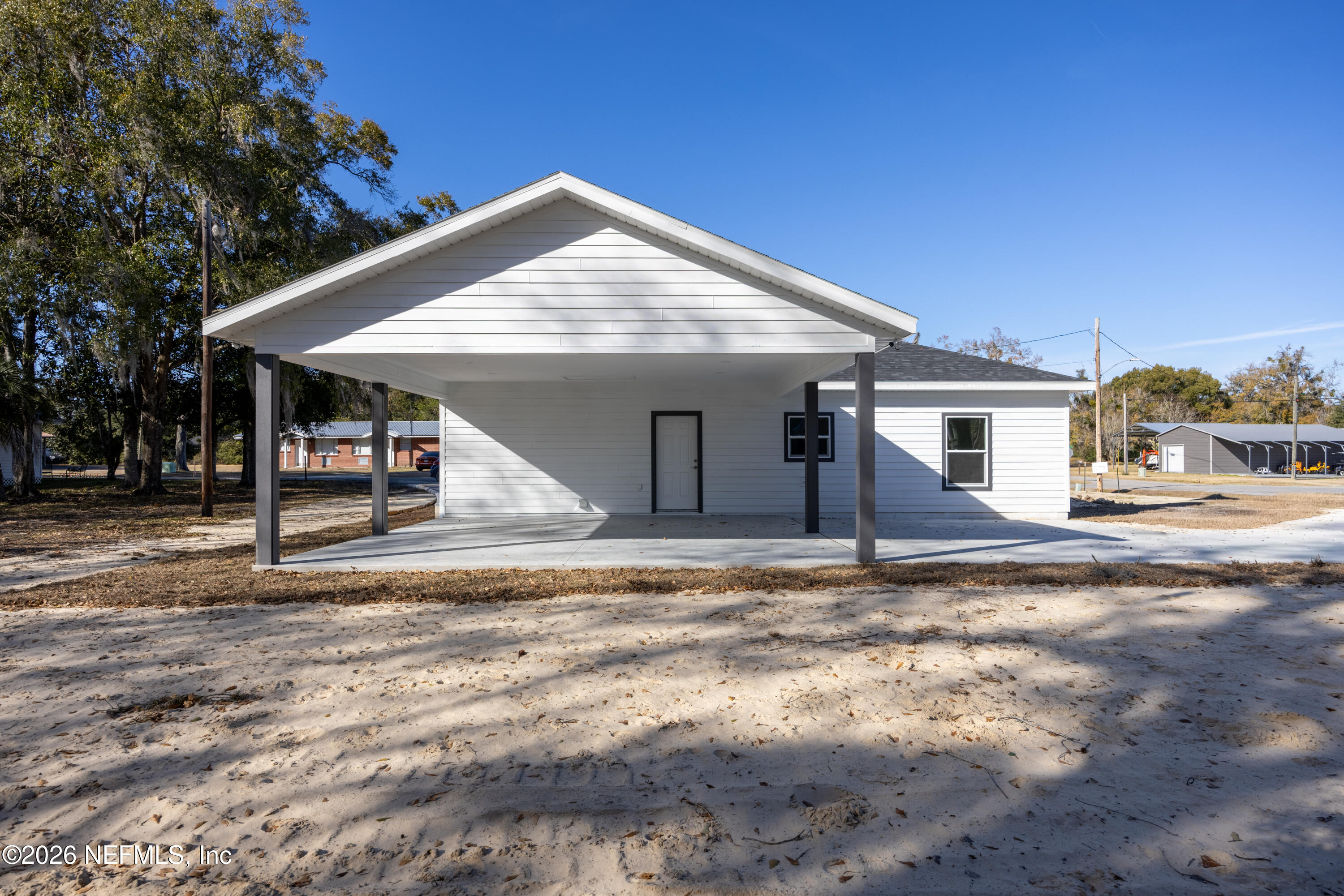 220 Southwest 3rd Street Lake Butler, FL 32054 - Photo 14 of 48 a view of a house with a entertaining space