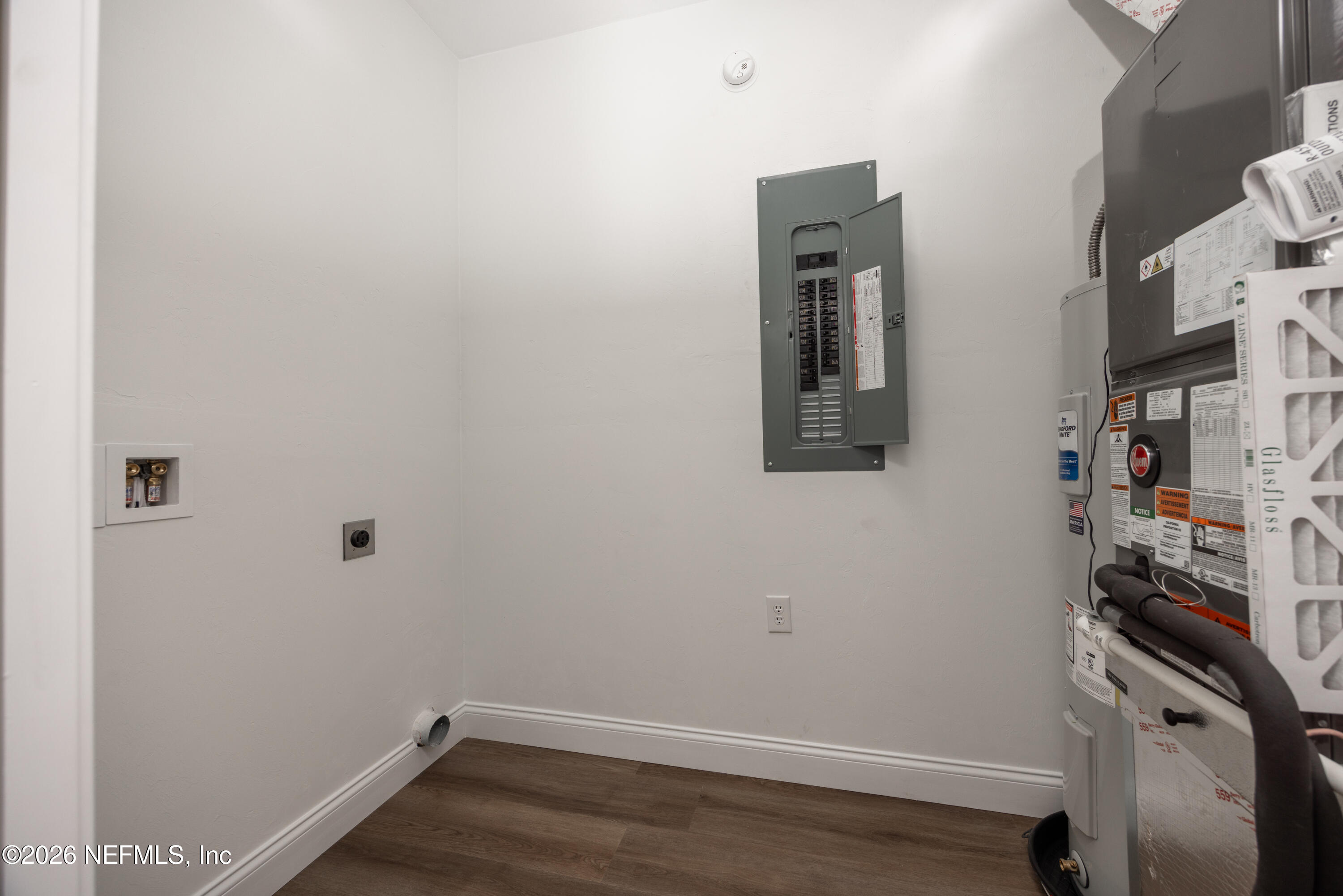 220 Southwest 3rd Street Lake Butler, FL 32054 - Photo 18 of 40 a view of storage and utility room with racks on the wall