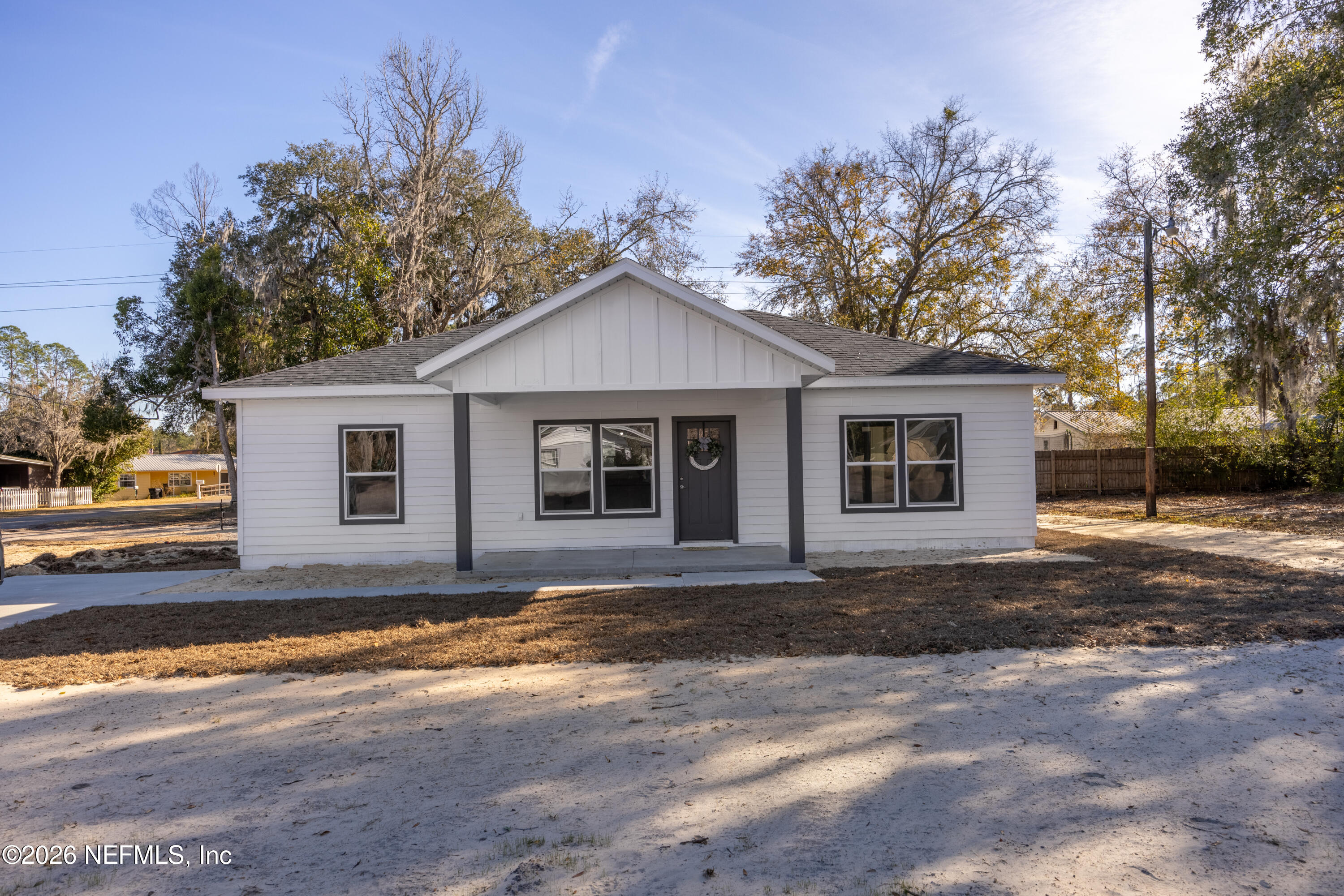 220 Southwest 3rd Street Lake Butler, FL 32054 - Photo 2 of 40 a front view of a house with a garden