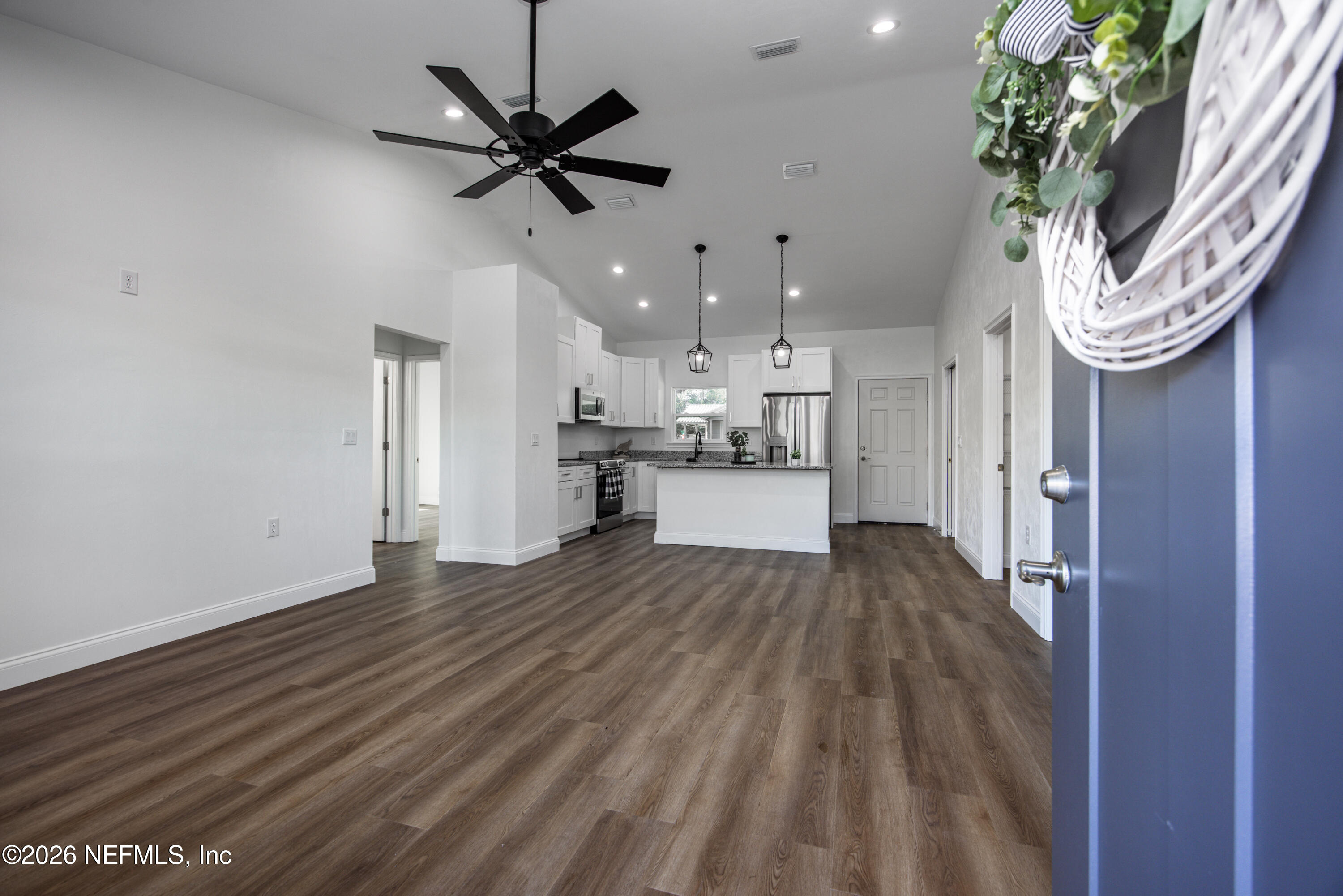 220 Southwest 3rd Street Lake Butler, FL 32054 - Photo 22 of 40 a view of empty room with wooden floor and ceiling fan