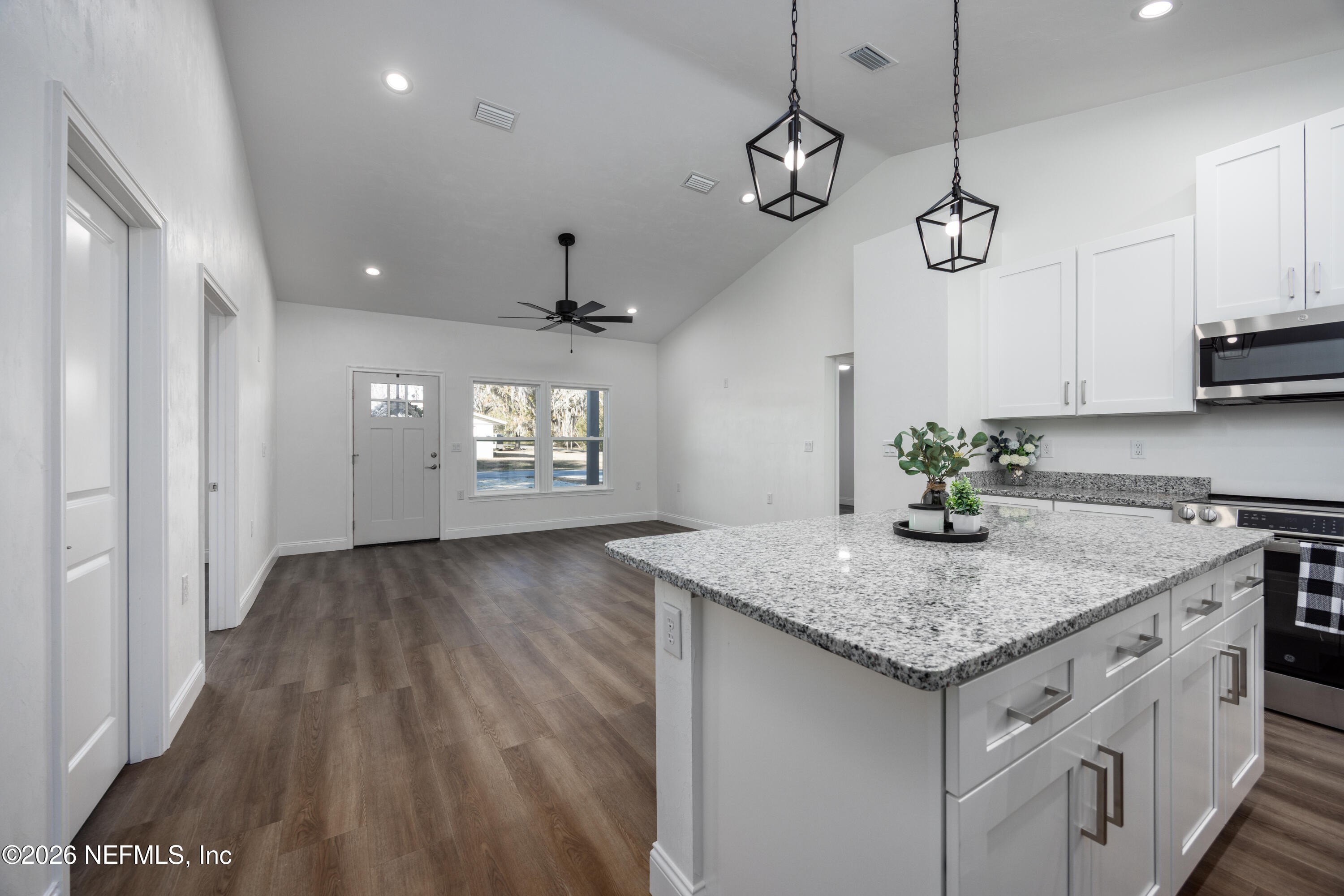 220 Southwest 3rd Street Lake Butler, FL 32054 - Photo 31 of 40 a view of a kitchen island wooden floor and a ceiling window