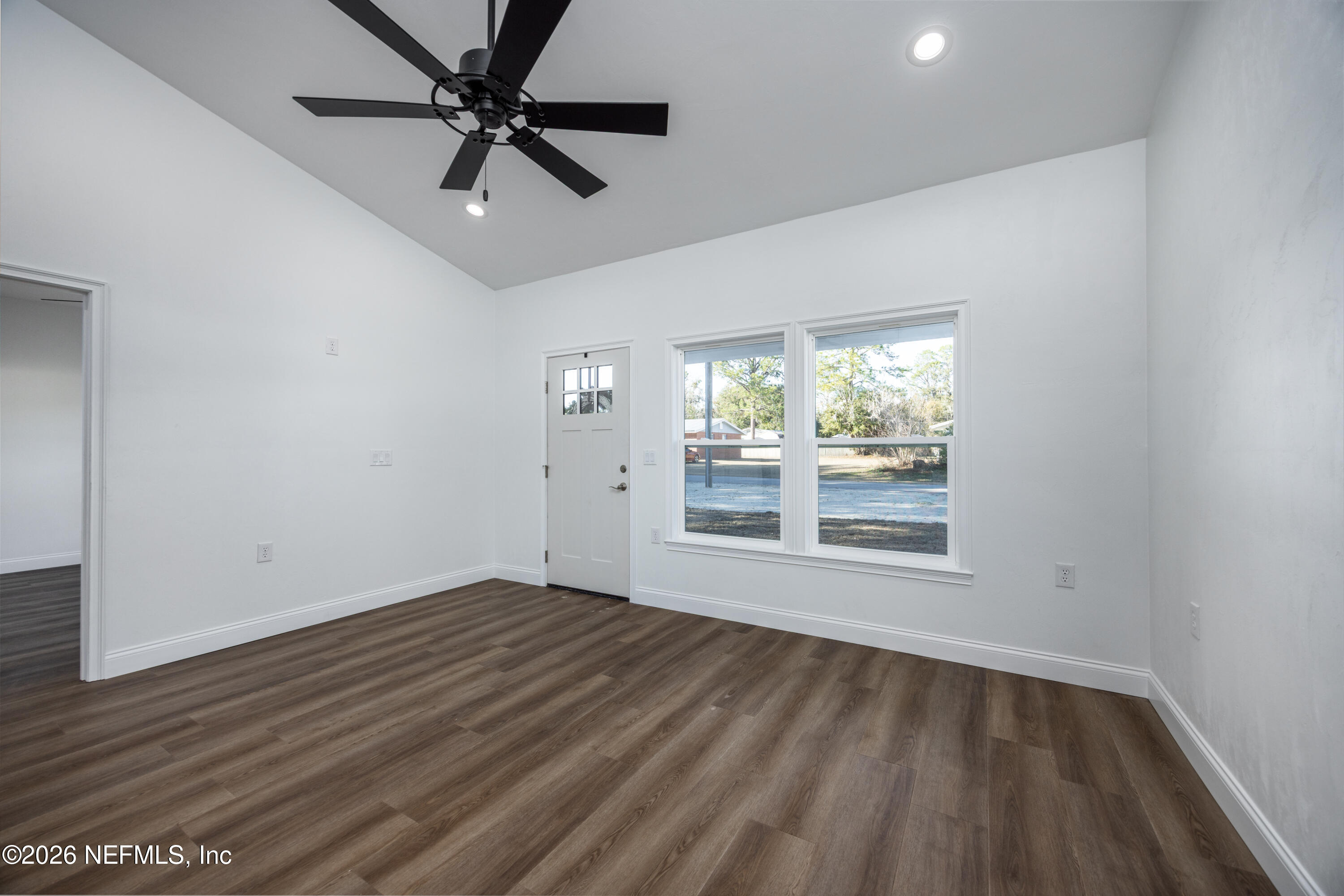 220 Southwest 3rd Street Lake Butler, FL 32054 - Photo 38 of 48 wooden floor in an empty room with a window