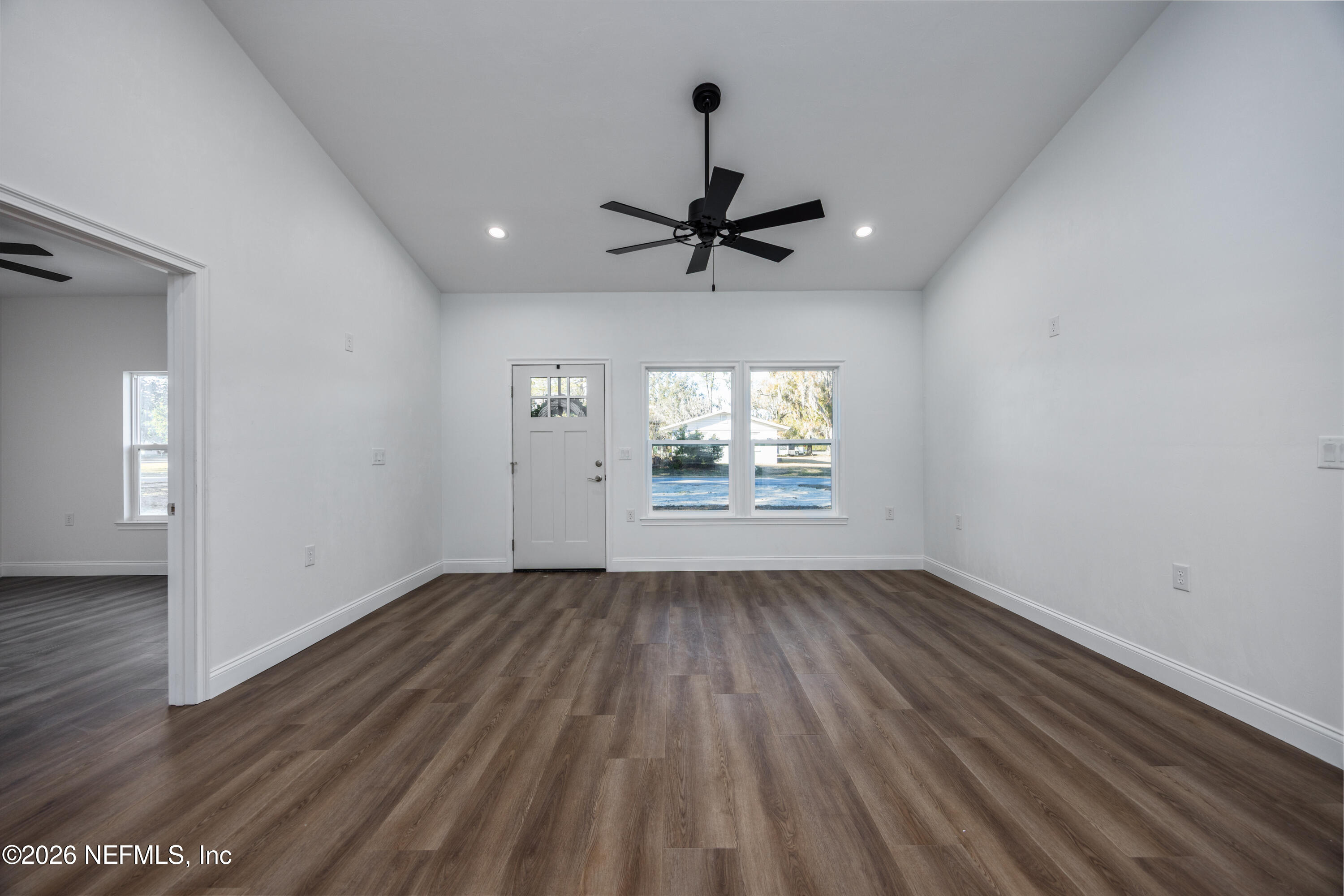 220 Southwest 3rd Street Lake Butler, FL 32054 - Photo 41 of 48 wooden floor in an empty room with a window