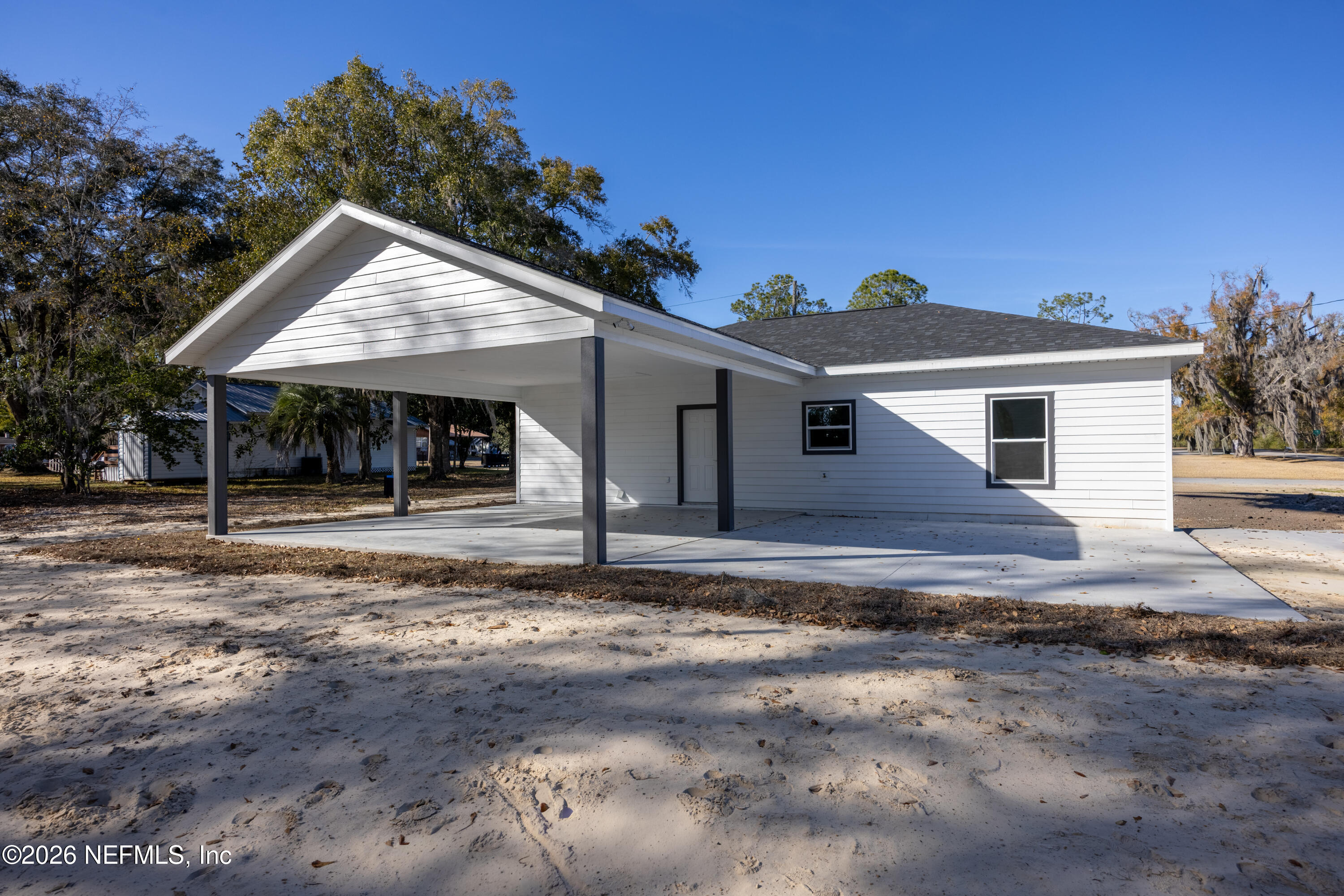 220 Southwest 3rd Street Lake Butler, FL 32054 - Photo 9 of 40 a front view of a house with a porch