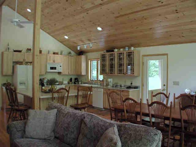 106 Harrington Road Otis, MA 01253 - Photo 3 of 5 a large kitchen with lots of counter space and furniture
