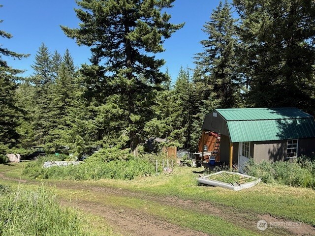 175 Ellemeham Road Loomis, WA 98827 - Photo 2 of 11 an aerial view of a house with yard and lake view