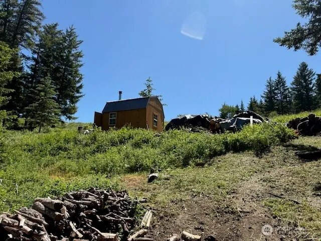 a view of a garden with a house