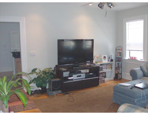 225 Carpenter Street, Unit 2 Providence, RI 02903 - Photo 4 of 9 a living room with furniture and a flat screen tv