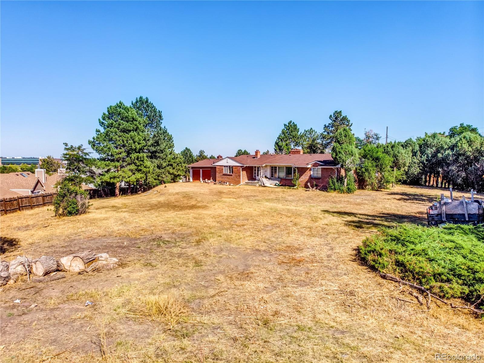 6766 Zenobia Loop Arvada, CO 80030 - Photo 11 of 38 a view of a chairs and table on the terrace