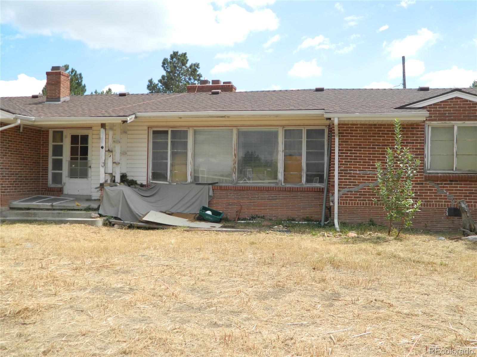 6766 Zenobia Loop Arvada, CO 80030 - Photo 12 of 38 a view of a house with patio