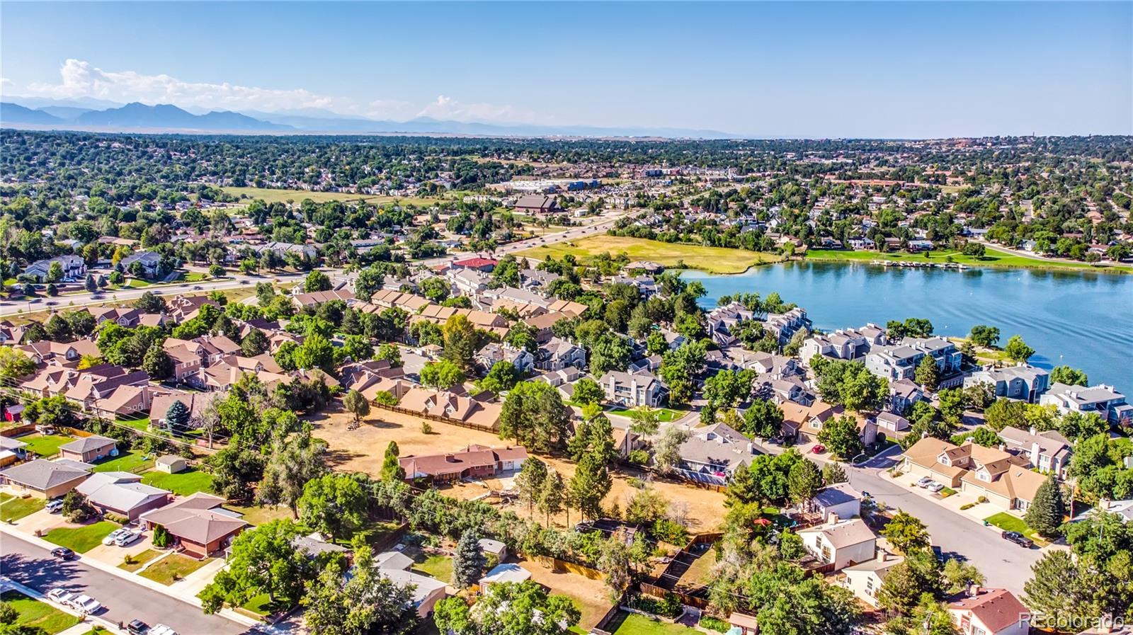 6766 Zenobia Loop Arvada, CO 80030 - Photo 31 of 38 an aerial view of a house with a lake view