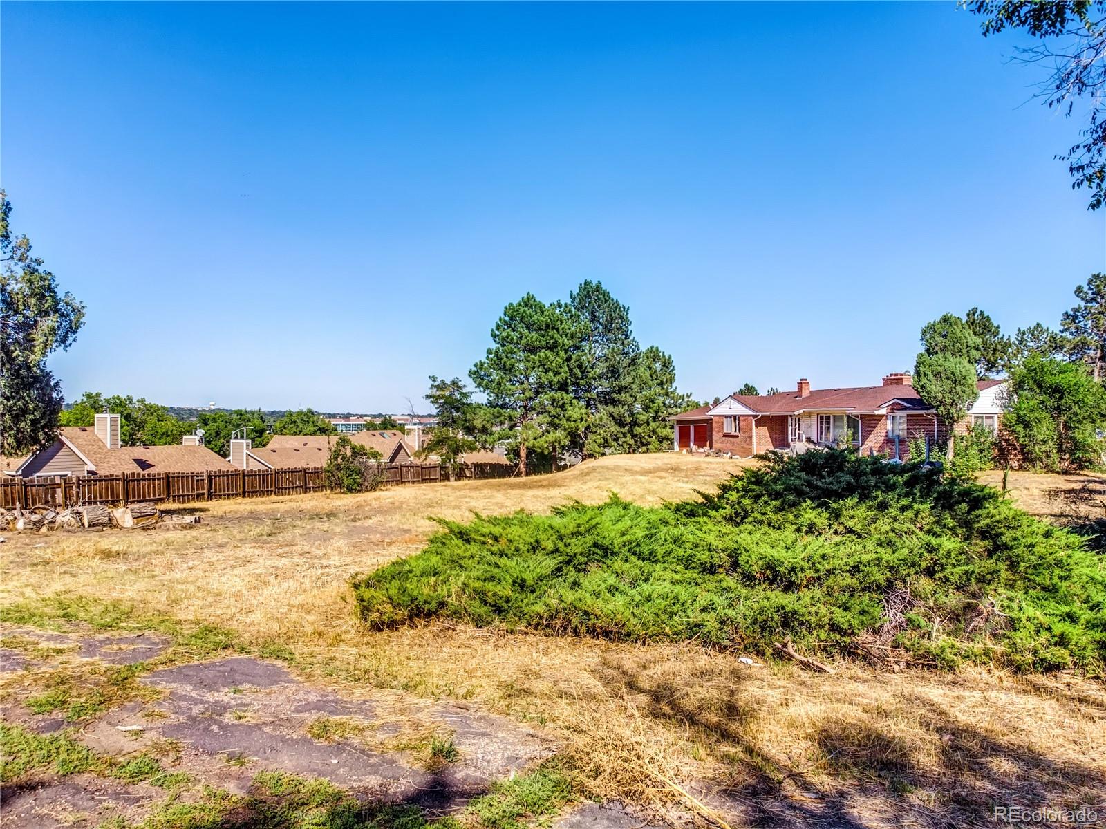 6766 Zenobia Loop Arvada, CO 80030 - Photo 4 of 38 a view of a ocean with a building in the background