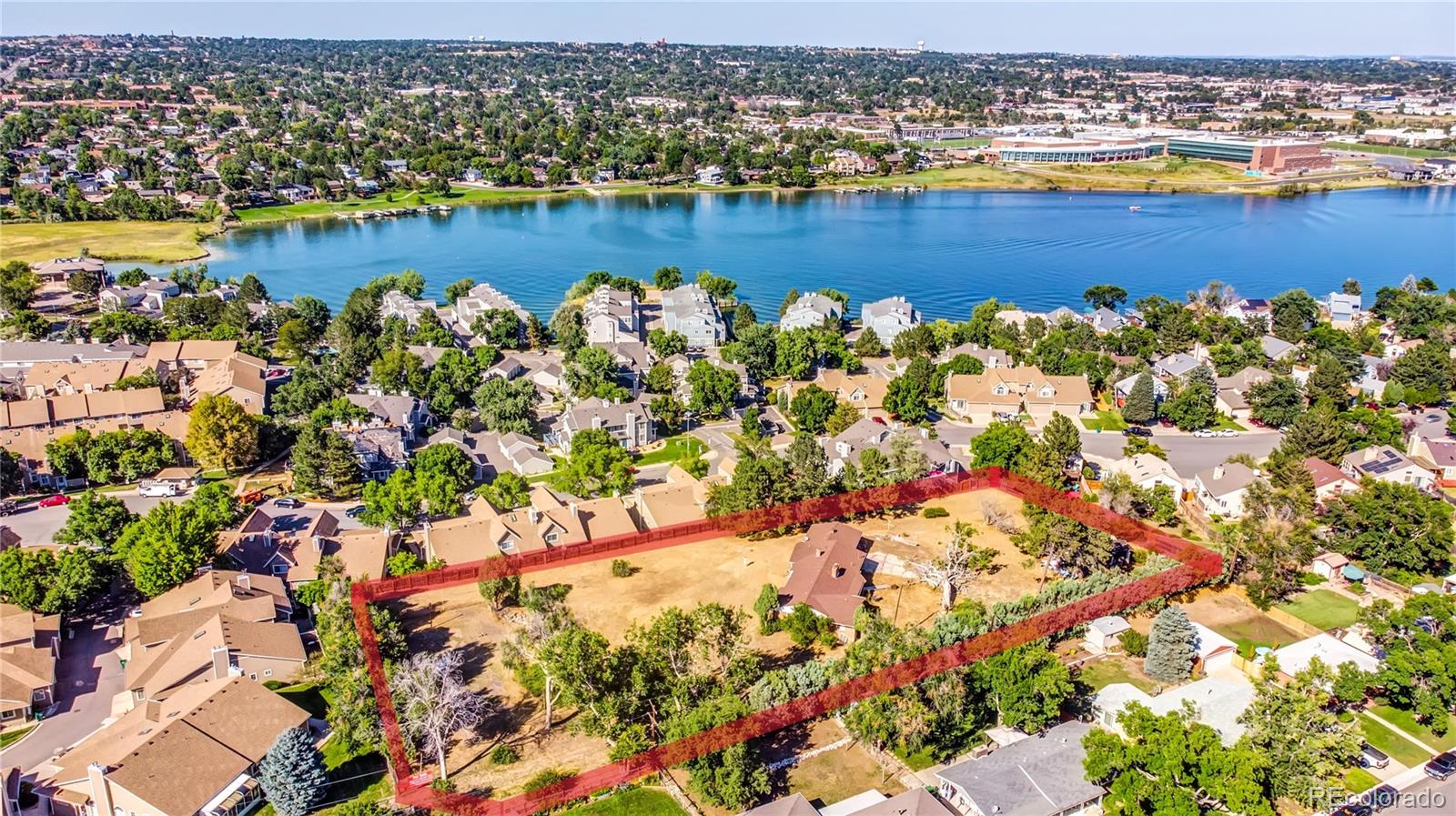 6766 Zenobia Loop Arvada, CO 80030 - Photo 7 of 38 an aerial view of a houses with a lake view