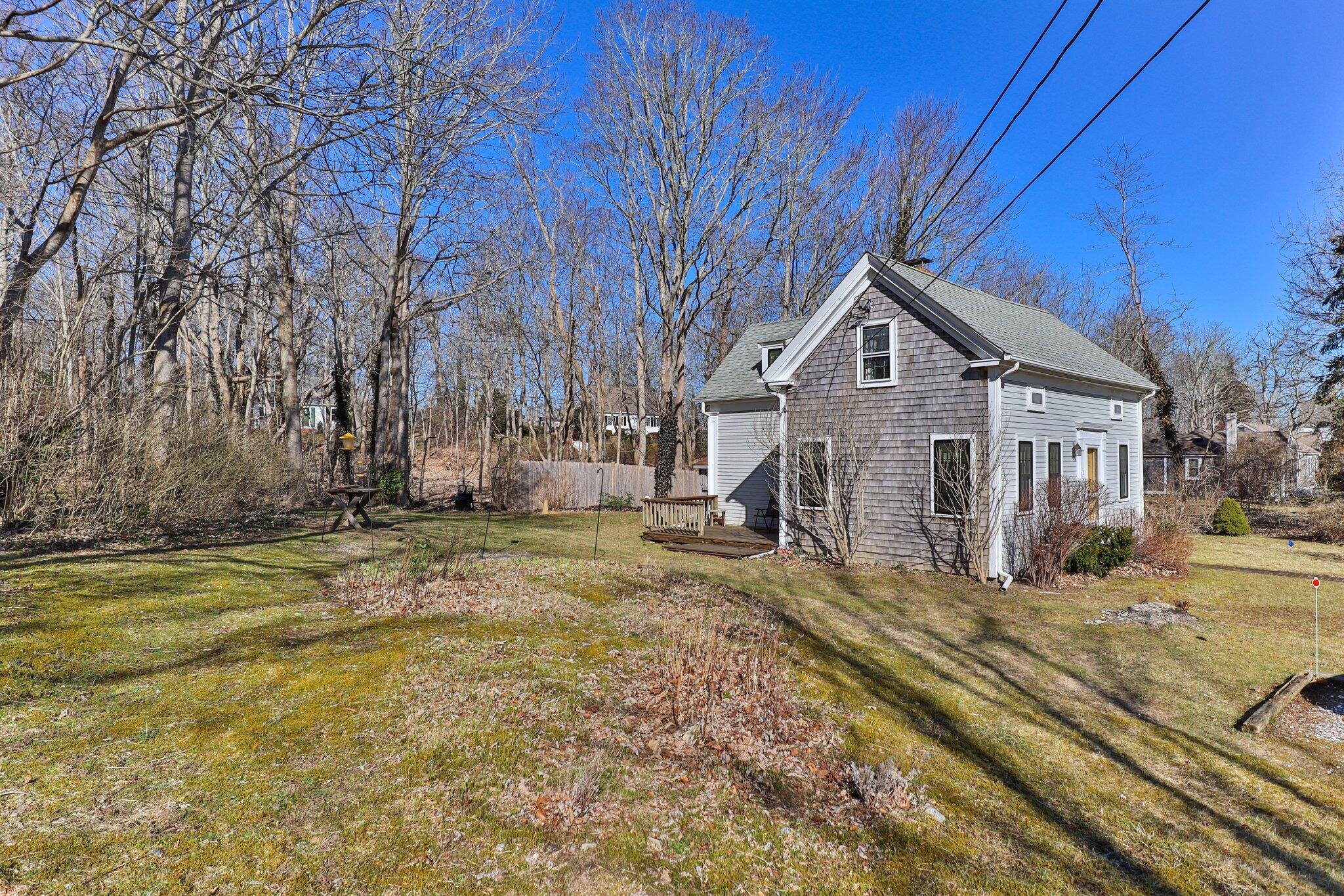 12 Childs Homestead Road Orleans, MA 02653 - Photo 24 of 39 a view of a house with a yard covered in snow