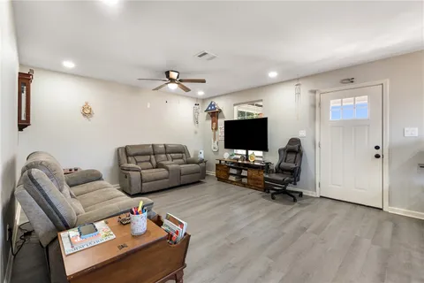 a kitchen with stainless steel appliances a refrigerator and a wooden cabinets