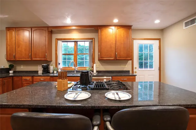 a view of a dining room with furniture and window