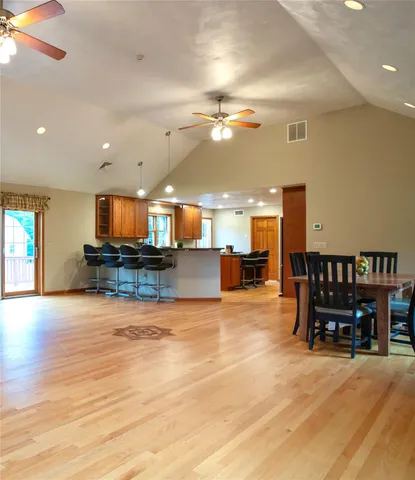 a view of kitchen with furniture and a chandelier