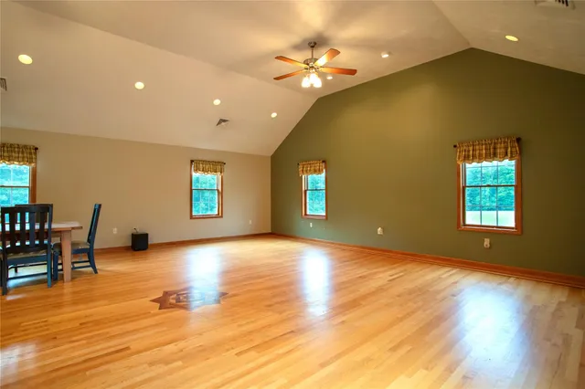 a view of a livingroom with a kitchen