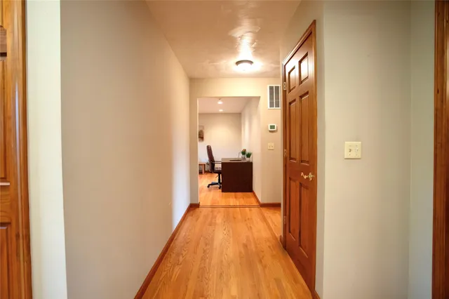 a view of a bedroom from a hallway