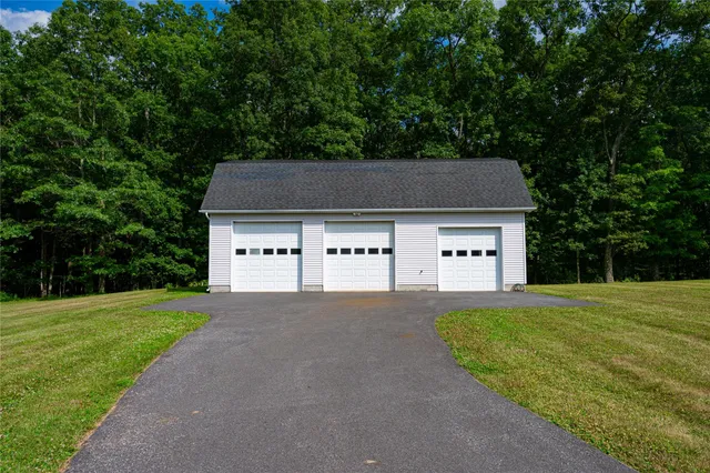 a house that has a tree in front of the house