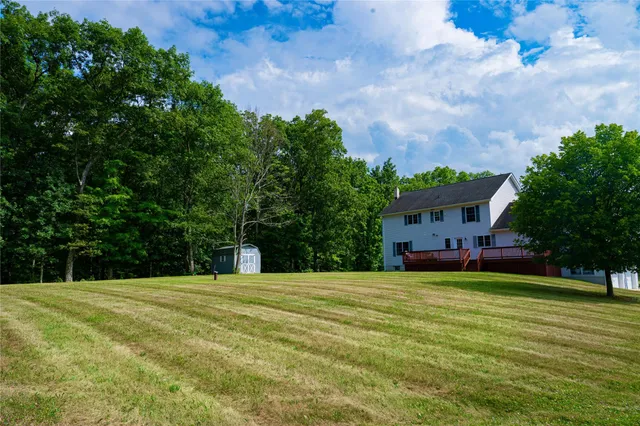 a view of a house with a big yard