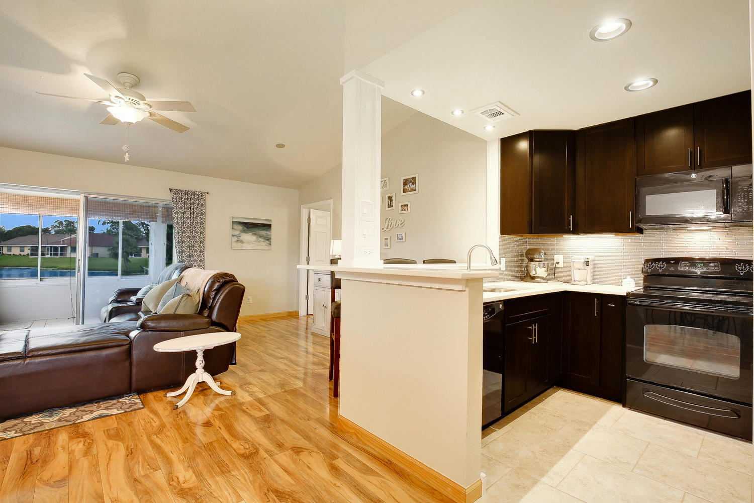 136 Stillwater Circle Jupiter, FL 33458 - Photo 8 of 20 Kitchen and Living Room