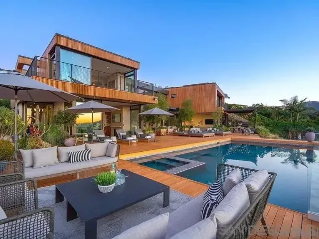 a view of a patio with swimming pool table and chairs